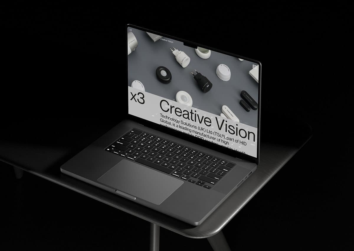 A laptop on a dark desk